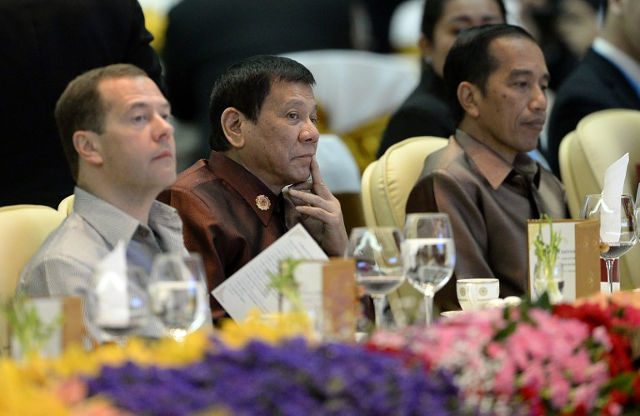 Duterte sits between Medvedev, Widodo during ASEAN dinner