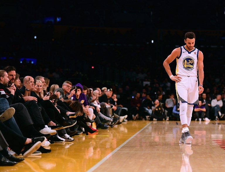 SLOW START. Stephen Curry #30 of the Golden State Warriors was off at regulation but came back strong in the extra period. Photo by Harry How/Getty Images/AFP 