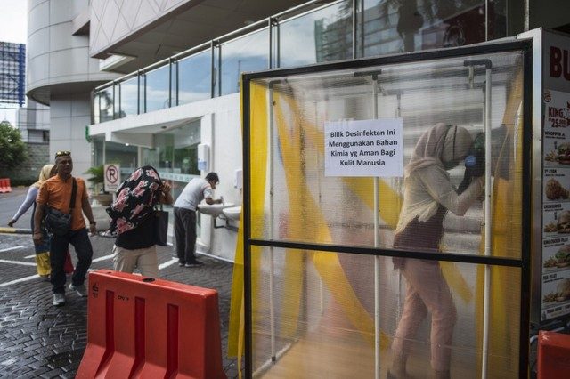 Jakarta imposes partial lockdown as coronavirus cases surge