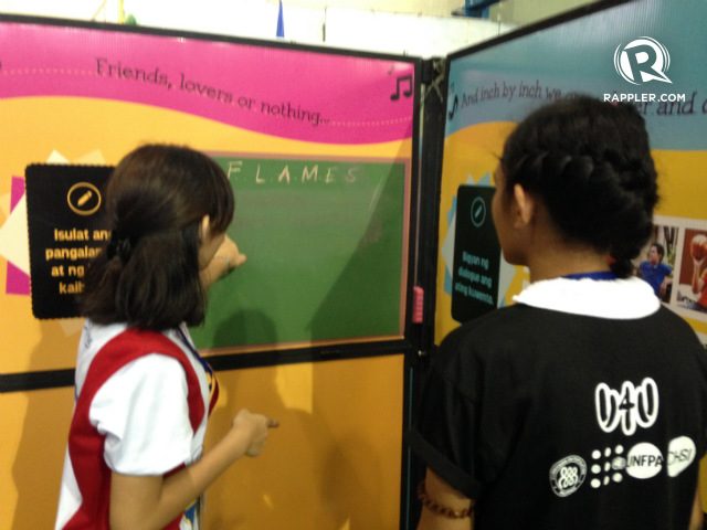 FRIENDS, LOVERS, OR NOTHING. The classic game FLAMES. is one of the activities in U4U's interactive exhibit. Photo by Jee Geronimo/Rappler