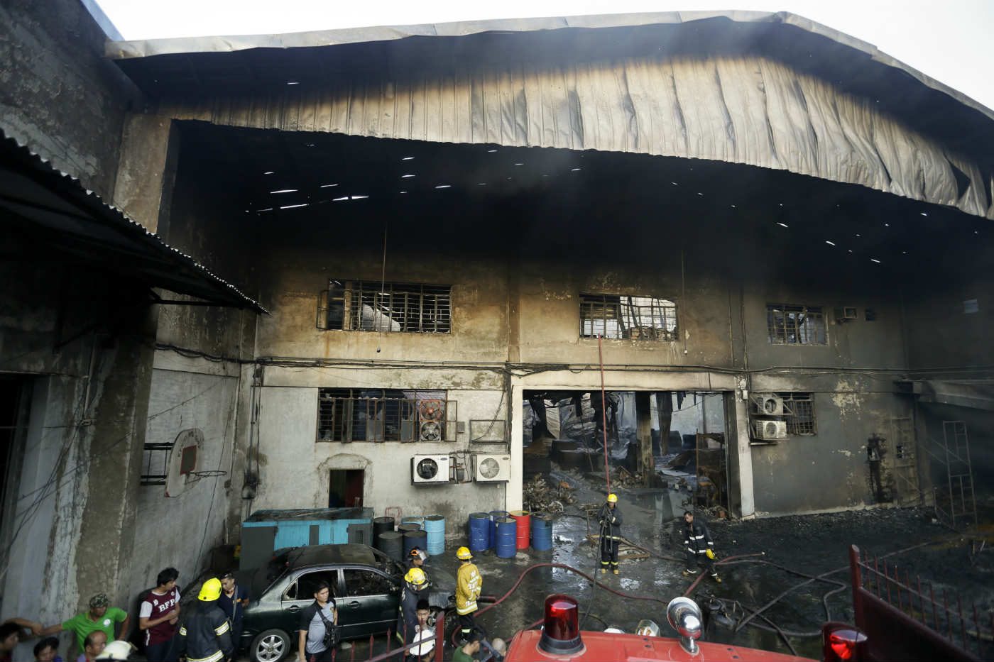 KENTEX FACTORY. A view of a burnt footwear factory following a fire in Valenzuela city, east of Manila, Philippines, 13 May 2015. Photo by Ritchie B. Tongo/EPA 