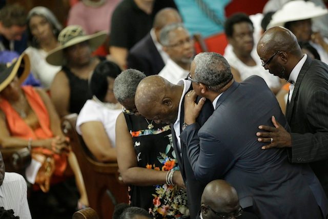 EMOTIONAL. Parishioners mourn inside the Emanuel African Methodist Episcopal (AME) Church in Charleston, South Carolina, USA, 21 June 2015. The African-American church in the southern US city of Charleston where nine people were slain by a white gunman reopened for services the same day. PEPA/DAVID GOLDMAN / POOL 