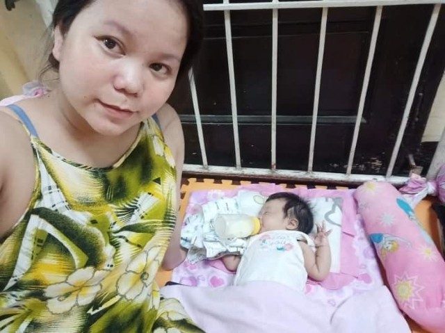 ONLY TWO MONTHS OLD. Roxane Serintas with her two-month-old baby inside an evacuation center. Photo from Serintas 