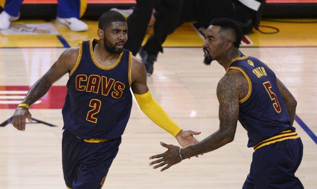 LIMPING CAV. Kyrie Irving (L) was a key part of keeping Cleveland in game 1, but left with a knee injury. Photo by John G. Mabanglo/EPA  