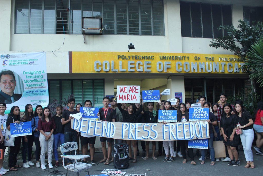 DEFEND. Students hold banners in a protest outside the Polytechnic University of the Philippines College of Communication to show support for Maria Ressa on February 14, 2019. Photo from The Catalyst-PUP 