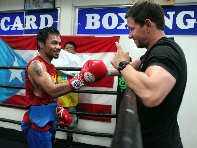 Manny Pacquiao greets a frequent visitor and long-time supporter. Photo by Chris Farina - Top Rank 