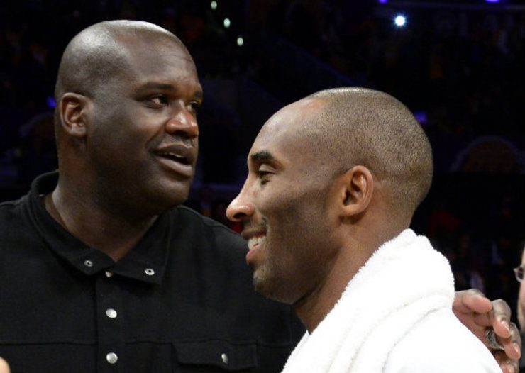 Former Lakers teammate Shaquille O'Neal greets Kobe Bryant after the game. Photo by Michael Nelson/EPA