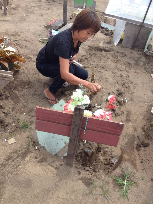 LOVING MEMORY. Maricel often visits the graves of her husband and mother-in-law in Palo, Leyte. Photo contributed by Cecile Laguardia