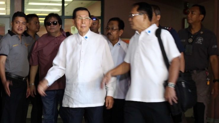 PLUNDER. Enrile is arraigned on plunder charges at the Sandiganbayan on July 11. Photo by Boy Santos/Sandiganbayan pool