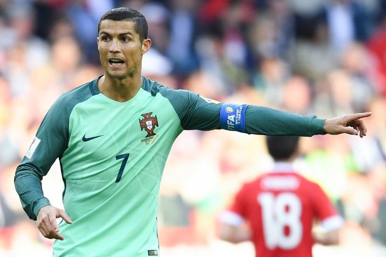 Ronaldo sets aside off-field problems in Portugal win
