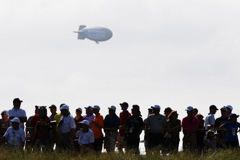 CRASH LANDING. Airsign, which operates the blimp, disputes earlier reports the pilot had parachuted out, saying he went down with the aircraft but that he's 'expected to be OK.' Photo by Ross Kinnaird/Getty Images/AFP  