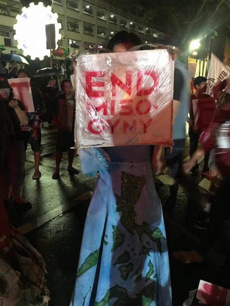 END. One of the smaller lanterns from the League of Filipino Students holds up a sign that reads "End misogyny". Photo by Fatima Qureshi/Rappler 