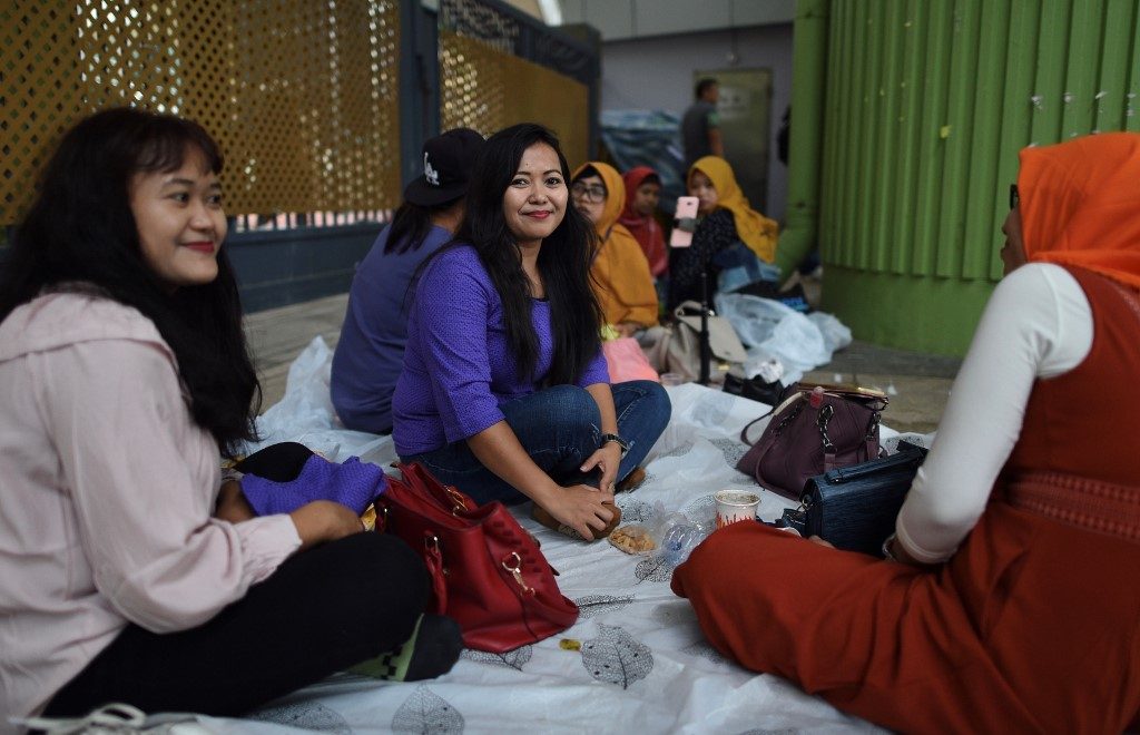 Hong Kong’s domestic workers dodge tear gas and clashes