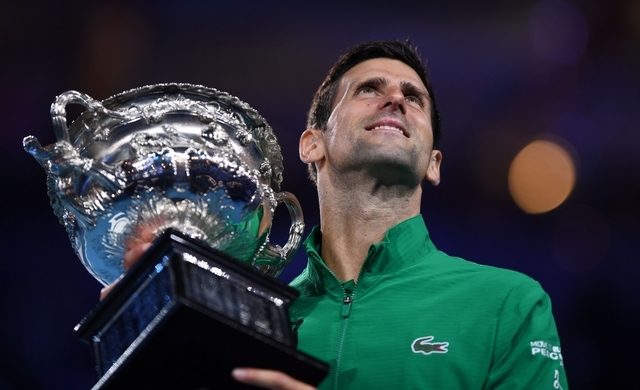 Djokovic beats Thiem in five-set thriller to win eighth Australian Open