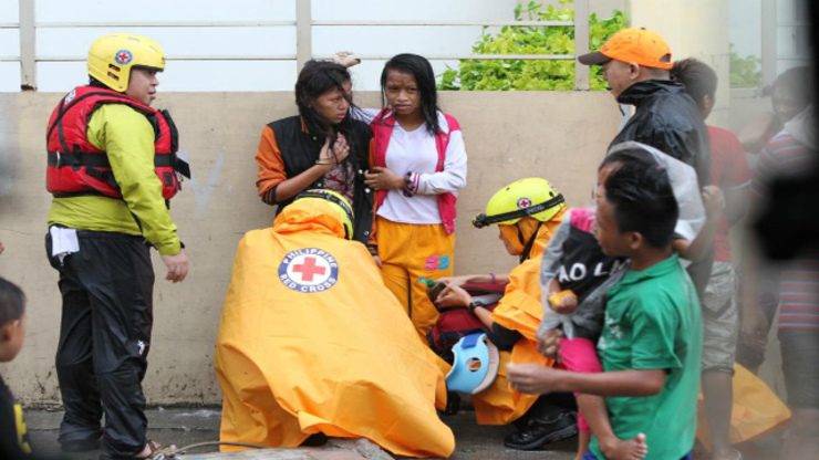 FIRST AID. PRC volunteers take care of injured evacuees. Photo from Philippine Red Cross Facebook Page 