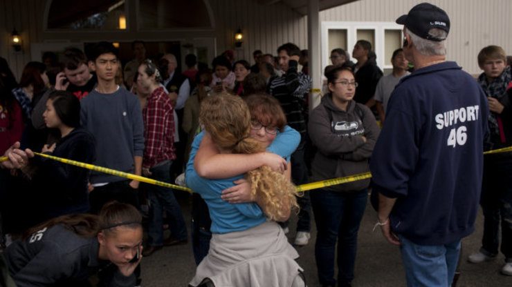 Students gather with parents and at Shoults Gospel Hall in Marysville, Washington, USA, 24 October 2014, after a school shooting that occured at the Marysville-Pilchuck High School nearby.  Photo by Mills McKnight/EPA