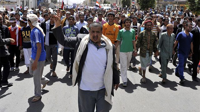Yemeni protesters shout slogans during a demonstration demanding the prosecution of Yemen’s ex-president Ali Abdullah Saleh in Sana'a, Yemen, 20 March 2014. Reports state thousands of Yemeni protesters took part in a demonstration to demand the scrapping of immunity for Saleh and his trial for the killing of more than 50 pro-democracy protesters in a rally of the Arab Spring uprising in 2011. EPA/YAHYA ARHAB