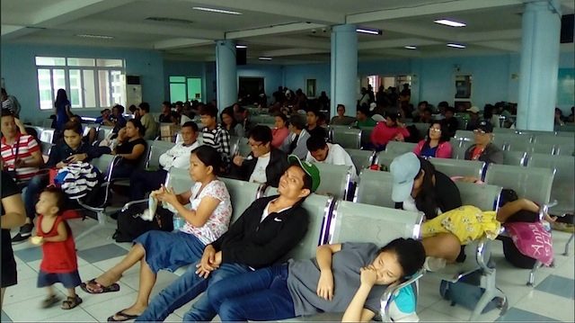 LONG WAIT. Passengers at the Tabaco port in Albay. Photo from the Philippine Coast Guard 