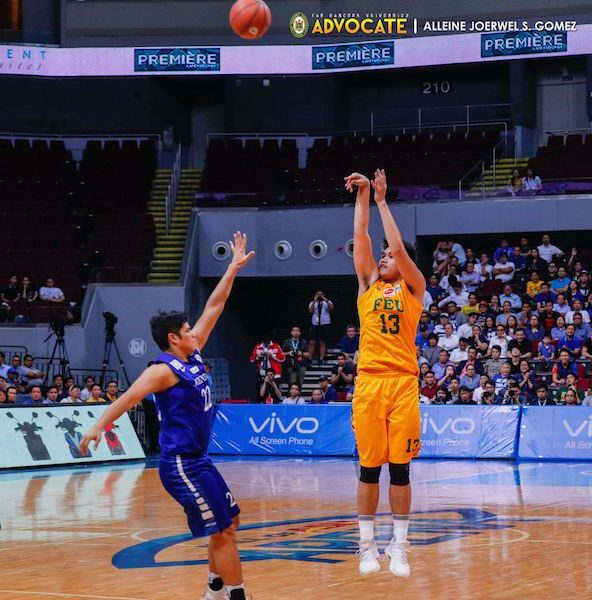 FOUL TROUBLE. Arvin Tolentino was in danger of fouling out as he made two fouls, including an unsportsmanlike foul, early in the first quarter. But the forward manages to put up 13 points in the match. Photo by Alleine Joerwel S. Gomez/FEU Advocate   