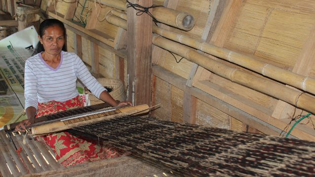 CULTURE. A Tboli woman engages in Tnalak weaving   
