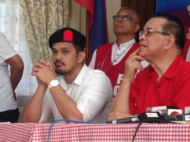 SIGN OF PROTEST. Pastor Greco Belgica (left) wears a beret 'in solidarity' with fallen members of the Philippine National Police-Special Action Force. Photo by Paterno Esmaquel II/Rappler 