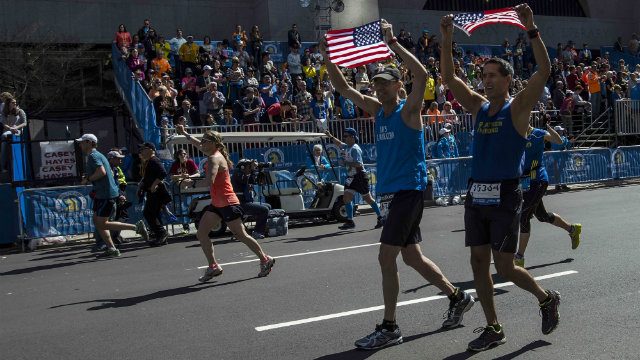 Runners reclaim Boston Marathon one year after attacks