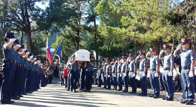 FINAL SALUTE. PNP Cordillera officers pay their respects to their fallen comrades in Camp Bado Dangwa, La Trinidad, Benguet, on January 31, 2015. Photo by Jessa Mardy N. Polonio