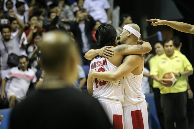 HUG. Mark Caguioa and Jayjay Helterbrand share a hug after Ginebra clinched its first Finals ticket in 3 years. Photo by Josh Albelda/Rappler  