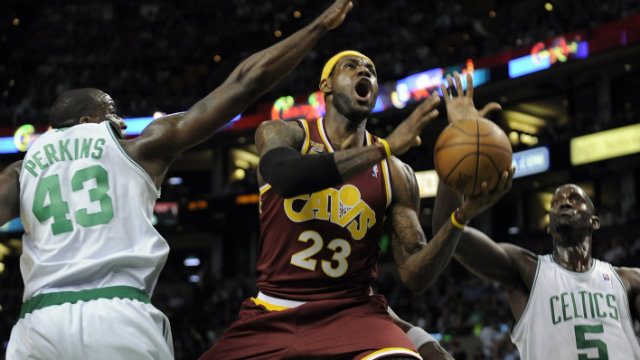 TWO-YEAR DEAL. LeBron James (C) seen here attempting to score against then Celtics big men Kendrick Perkins (L) and Kevin Garnett (R)  will sign a two-year deal to return to the Cavs. File photo by Matt Campbell/EPA