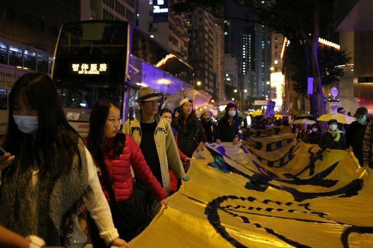 Hong Kong protesters mark Christmas Eve with democracy march