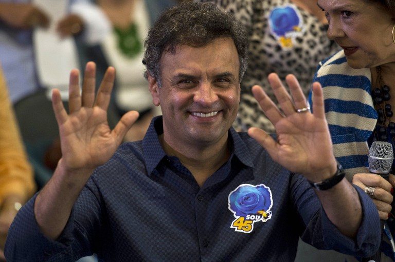 Brazil's presidential candidate for the Brazilian Social Democratic Party (PSDB), Aecio Neves, attends a campaign meeting with female supporters in Sao Paulo, Brazil, on September 17, 2014. Nelson Almeida/AFP