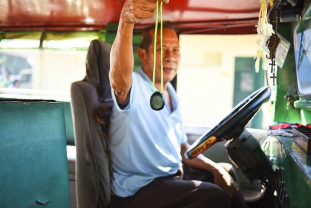 A jeepney driver holds Agimat, a device developed by Open Garden, that works as bluetooth repeaters. Photo from Open Garden, Inc.  