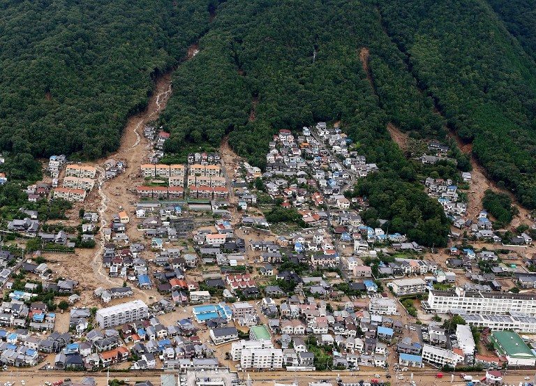 This aerial view shows the damage caused by a landslide after heavy rains hit the city of Hiroshima, western Japan, on August 20, 2014. Jiji Press/AFP