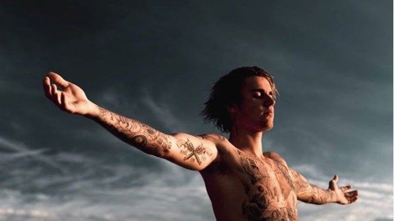 Why is Justin Bieber challenging Tom Cruise to a UFC fight?