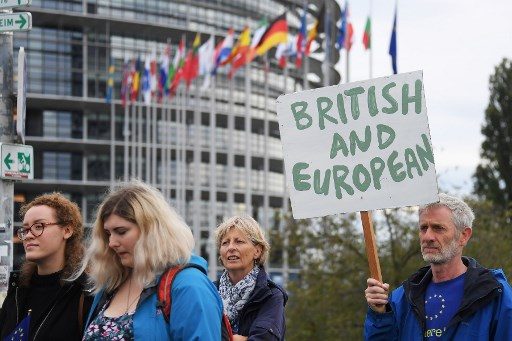 British MPs vote to delay Brexit deal decision
