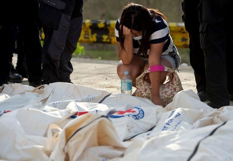 GRIEF. In this file photo taken on Nov 19, 2013, Mary Joy Ducusin reacts as she finds her missing 6 year old son, British citizen Jairo Ben among the bodies brought to one of three mass burial sites where they so far have received more than one thousand typhoon victims in Tacloban, after Super Typhoon Haiyan swept over the central Philippines. File photo by Odd Andersen/AFP