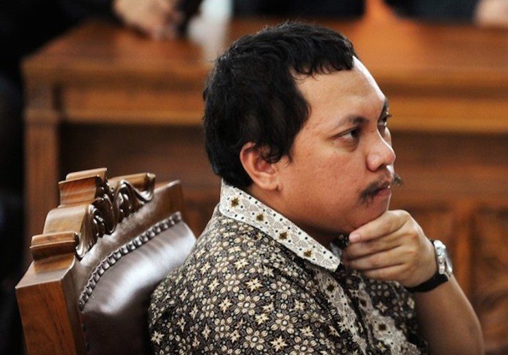 Indonesian tax officer Gayus Tambunan listens to the judge's verdict in Jakarta court on January 19, 2011. Photo by Romeo Gacad/AFP
