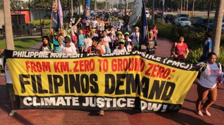 CLIMATE JUSTICE. Groups demand accountability from governments around the world to commit to greener solutions to the world's problems. Photo by Joel Leporada/Rappler