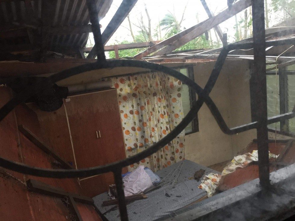 INTENSITY. The combination of strong winds and heavy rain destroys the roof of a home in Santiago City. Photo by Ralph Babaran 