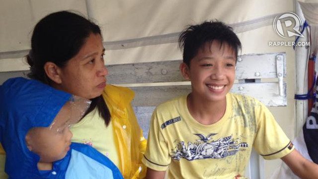REUNITED. Joanne, A mother is reunited with her 13-year-old son Raprap Guevarra on Monday morning, October 19, in Aduas Norte village, Cabanatuan City. Photo by Pia Ranada/Rappler 