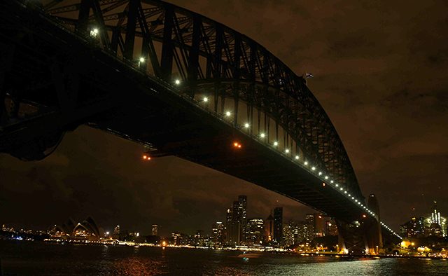 EARTH HOUR. In a long exposure image, the Sydney skyline during Earth Hour (below) in Sydney, from Milson's Point, Australia, 19 March 2016. Sam Mooy/EPA 