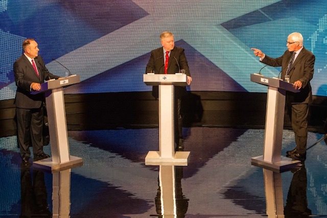 DEBATE NO. 1. Leader of the 'Better Together' campaign and former British minister Alistair Darling (R) gestures as he speaks during an STV live television debate on Scottish independence with Scotland's First Minister Alex Salmond (L) and moderated by Bernard Ponsonby (C) in Glasgow, Scotland on August 5, 2014. Peter Devlin/Pool/EPA