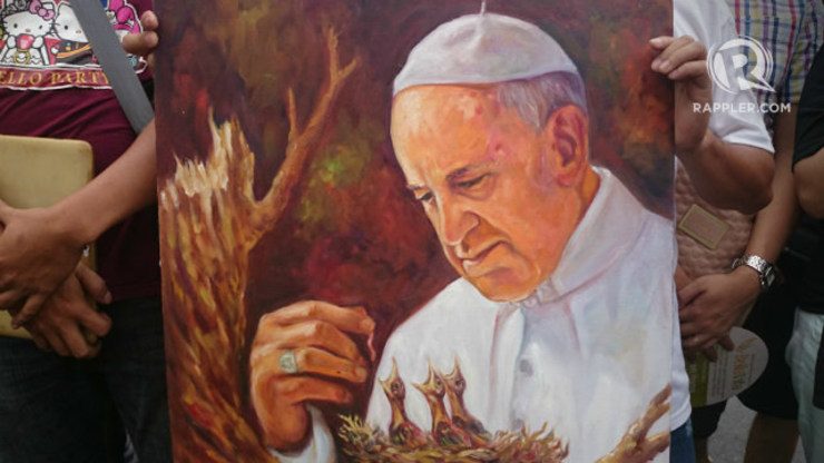 MERCIFUL. A painting that represents Pope Francis as the one who gives mercy to Yolanda victims. Photo by Sarah Jayne Olan/ Rappler
