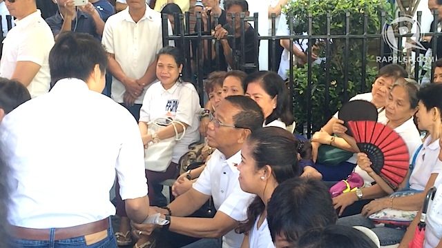 CAMPAIGN MANAGER: The son of Senator Grace Poe welcomes Vice President Jejomar Binay to the commemoration mass. Rappler photo