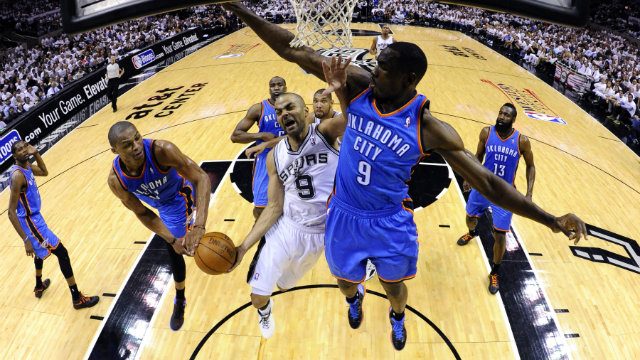Serge Ibaka (R), seen during the 2012 West Finals defending a Tony Parker shot, has been the key to their defense. Photo by Larry W. Smith/EPA