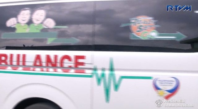 BONG GO BRANDING. A screenshot of an RTVM video shows the donated ambulance has Bong Go's face and slogan on it. RTVM screenshot 