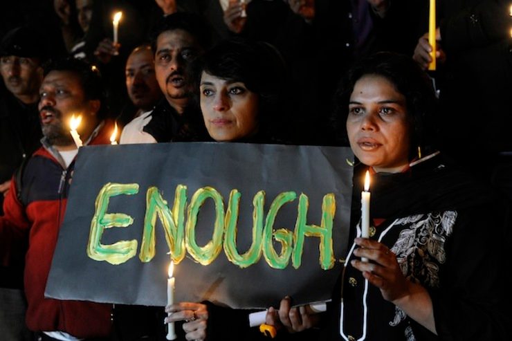 'ENOUGH.' Pakistani journalists light candles to pray for the victims who were killed in an attack at the Army run school in Peshawar, during a memorial ceremony in Islamabad Pakistan, 16 December 2014. Photo by T. Mughal/EPA