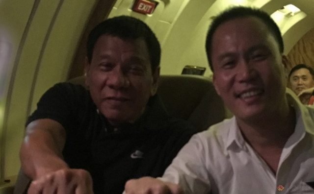 CONSULTANT.' President Rodrigo Duterte and adviser Michael Yang sit beside each other. Photo from Philippine Full Win Group of Companies website 