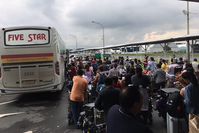 AIRPORT SHUTTLE. Passengers of diverted flights to the Clark International Airport queue for buses that would take them to NAIA in Pasay City on August 17, 2018. Photo courtesy of CIAC - Corporate Communications Office 