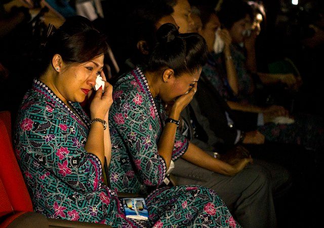 PAIN OF LOSS. Malaysia Airlines crew members cry during multi-faith prayers for passengers and crew of crashed Malaysia Airlines flight MH17 at the Malaysia Airlines Academy in Kelana Jaya, Malaysia, 25 July 2014. Azhar Rahim/EPA
